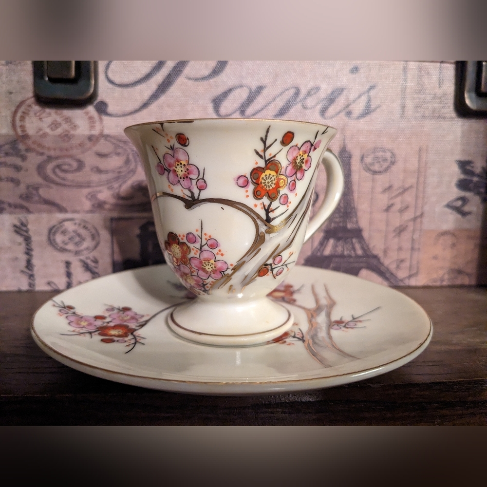 Japanese Teacup and Saucer with Dogwood Design and Gold Trim.